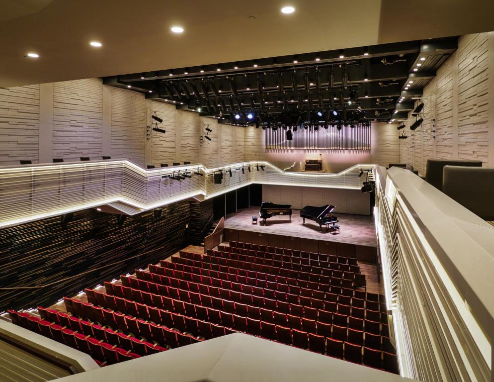 a view of a theatre with red seats at Elma Hotel and Art Complex in Zikhron Ya'akov