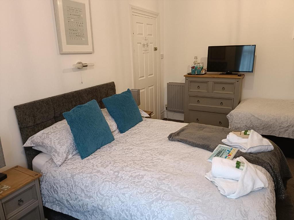Postel nebo postele na pokoji v ubytování Tregella Guest House