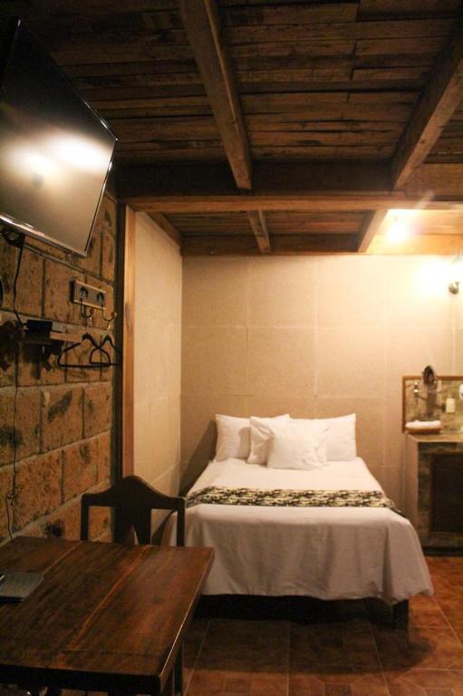 Postel nebo postele na pokoji v ubytování Hotel Real Nirvana