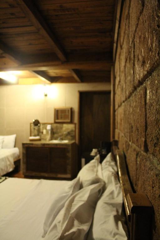 Postel nebo postele na pokoji v ubytování Hotel Real Nirvana