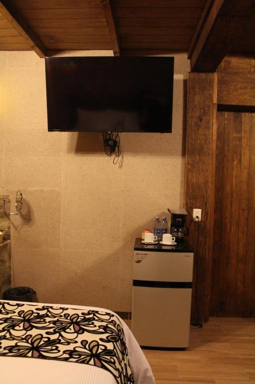 Postel nebo postele na pokoji v ubytování Hotel Real Nirvana