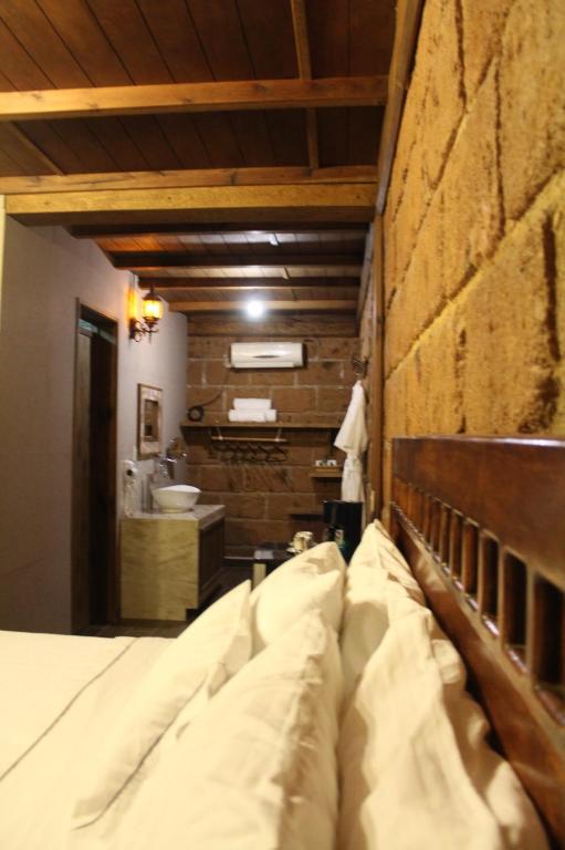 Postel nebo postele na pokoji v ubytování Hotel Real Nirvana