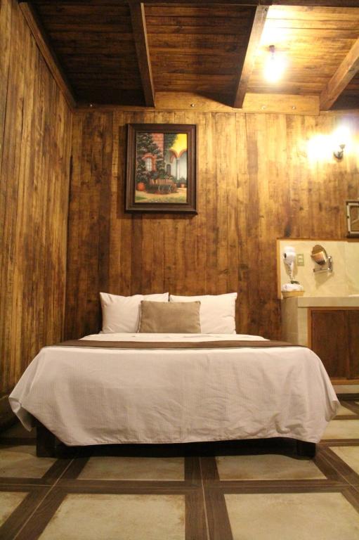 Postel nebo postele na pokoji v ubytování Hotel Real Nirvana
