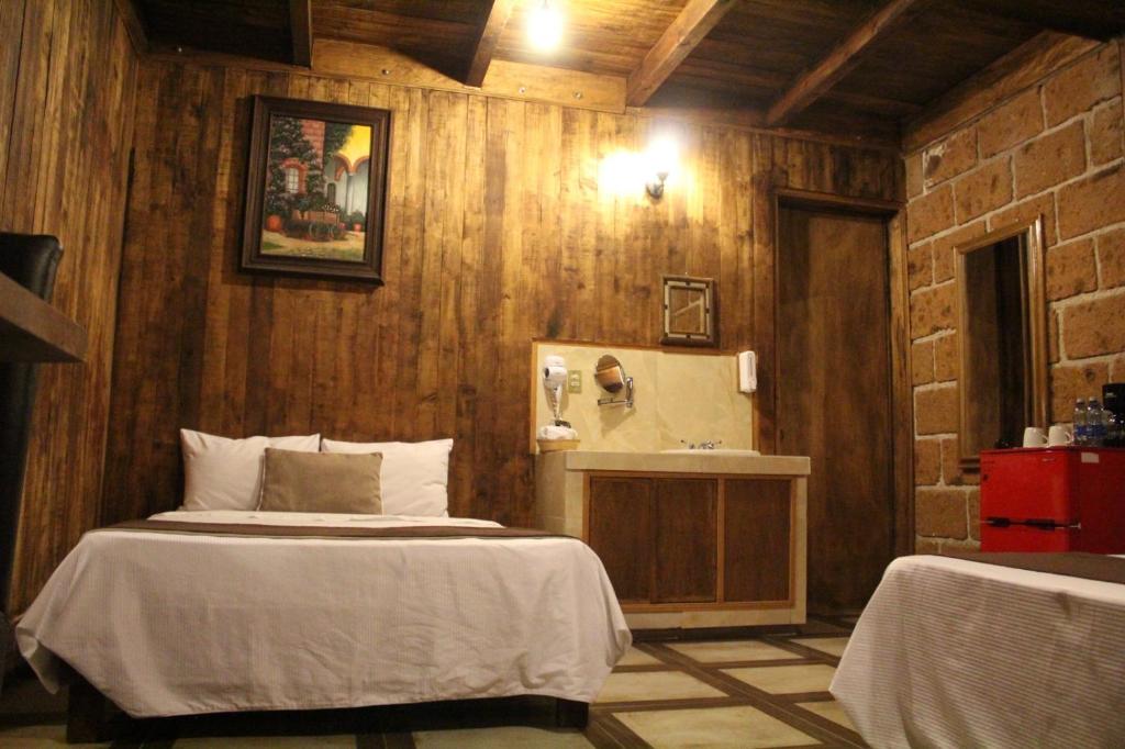 Postel nebo postele na pokoji v ubytování Hotel Real Nirvana