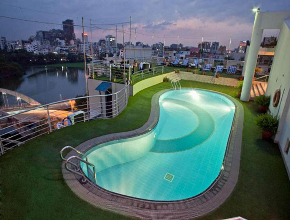 a large swimming pool on top of a building at Lakeshore Hotel & Apartments in Dhaka