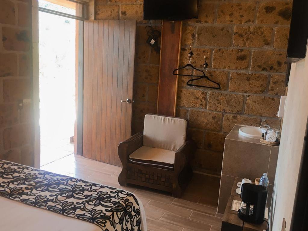 Postel nebo postele na pokoji v ubytování Hotel Real Nirvana