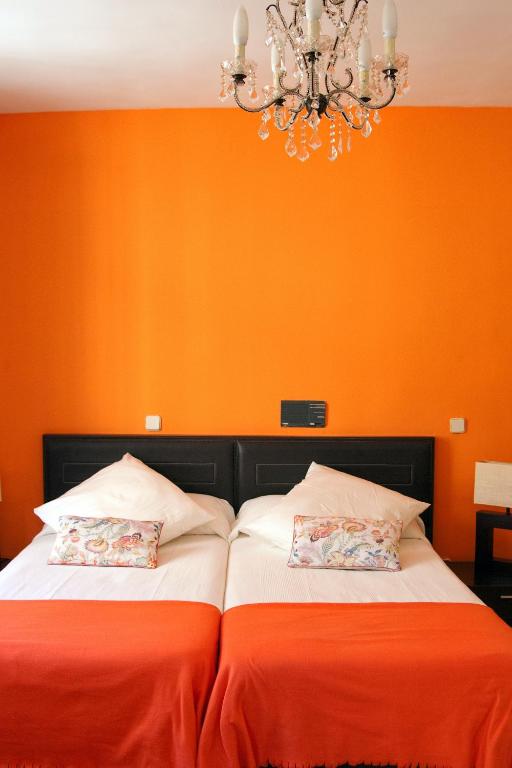 Postel nebo postele na pokoji v ubytování Gran Hostal San Segundo