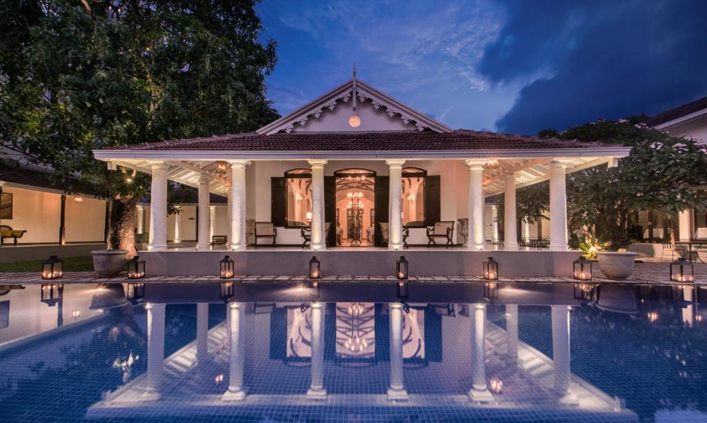 a house with a swimming pool in front of it at Uga Residence - Colombo in Colombo