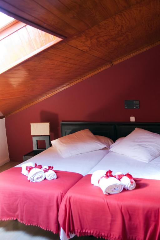Postel nebo postele na pokoji v ubytování Gran Hostal San Segundo