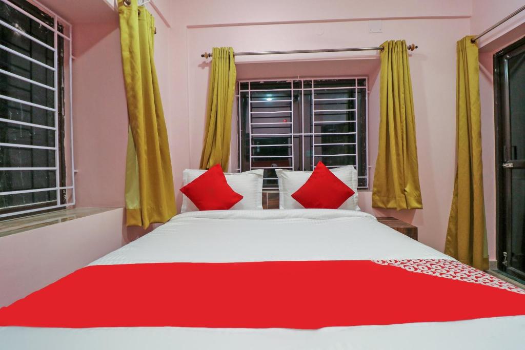 Postel nebo postele na pokoji v ubytování Collection O NEOSTAY TOWN HOUSE