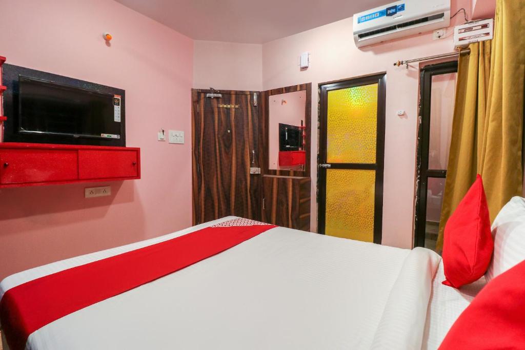 Postel nebo postele na pokoji v ubytování Collection O NEOSTAY TOWN HOUSE