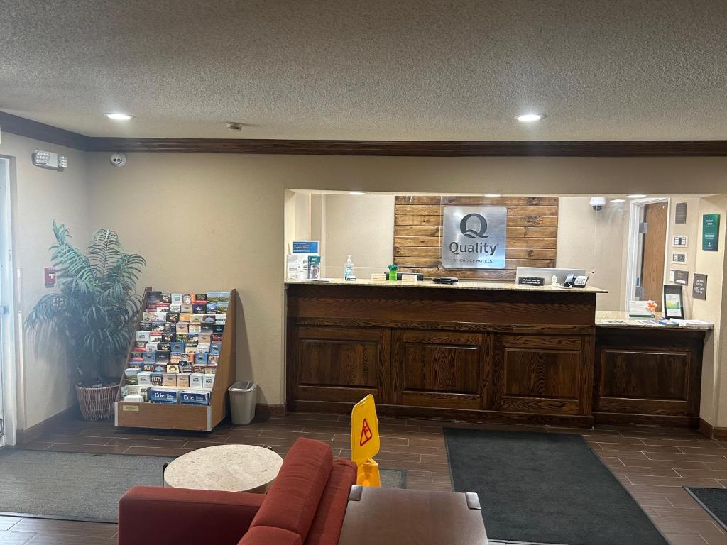 a waiting room with a counter in a store at Quality Inn & Suites Bradford in Bradford