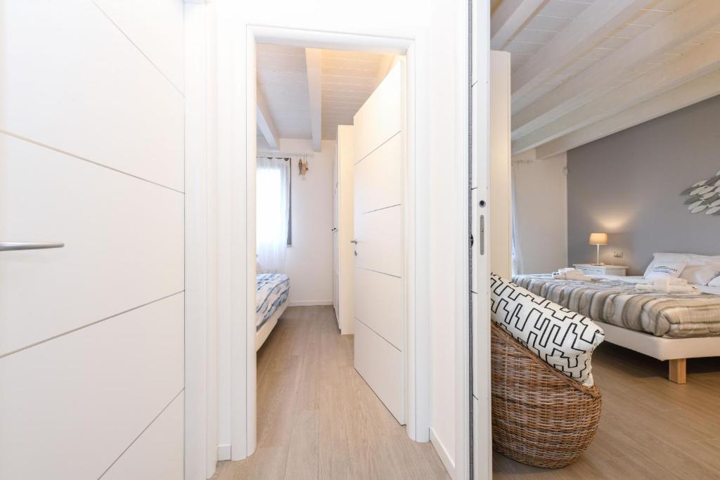 Łóżko lub łóżka w pokoju w obiekcie Borgo Gasparina Family Apartments