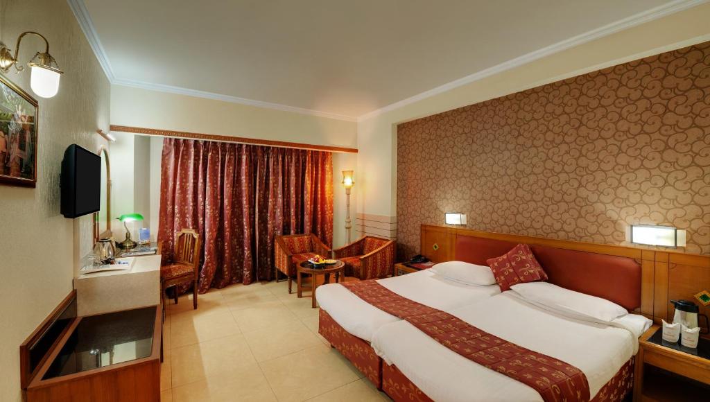 Postel nebo postele na pokoji v ubytování Hotel Amar