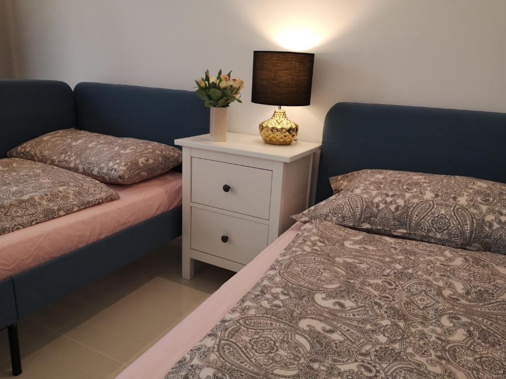 Postel nebo postele na pokoji v ubytování Laguna Apartment HAWANA SALALAH Resort