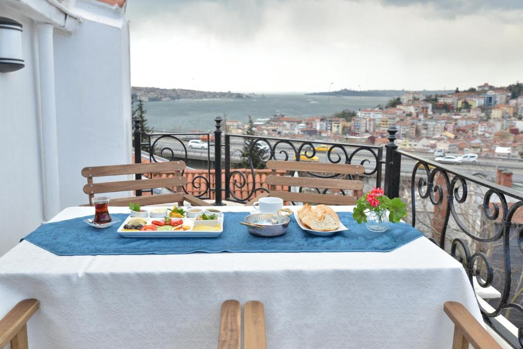 a table with a plate of food on a balcony at Deep Hotel in Istanbul
