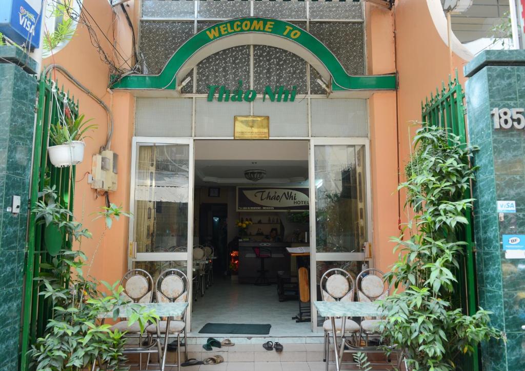 an entrance to a restaurant with tables and chairs at Thao Nhi Hotel in Ho Chi Minh City