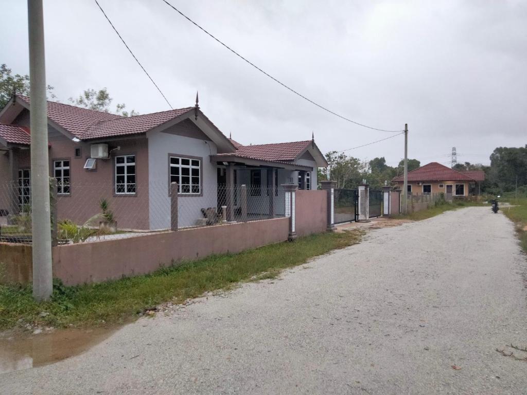 a house on the side of a road at Warisan homestay jerteh in Jertih