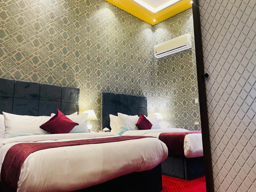 Postel nebo postele na pokoji v ubytování Cairo Inn