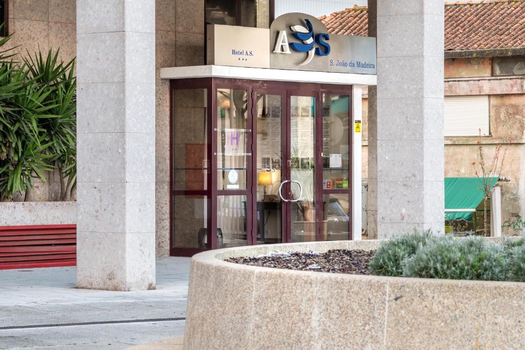 a lobby of a building with a sign on it at Hotel A.S. Sao Joao da Madeira in São João da Madeira