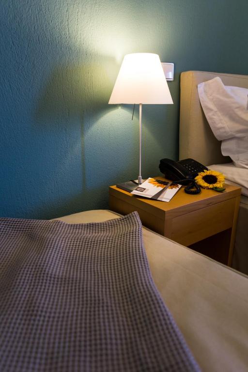 Postel nebo postele na pokoji v ubytování Helianthus Guesthouse