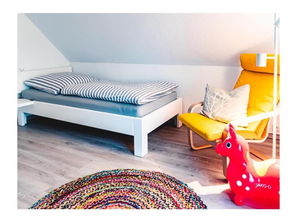 Postel nebo postele na pokoji v ubytování Ferienhaus Familienkoje Rike