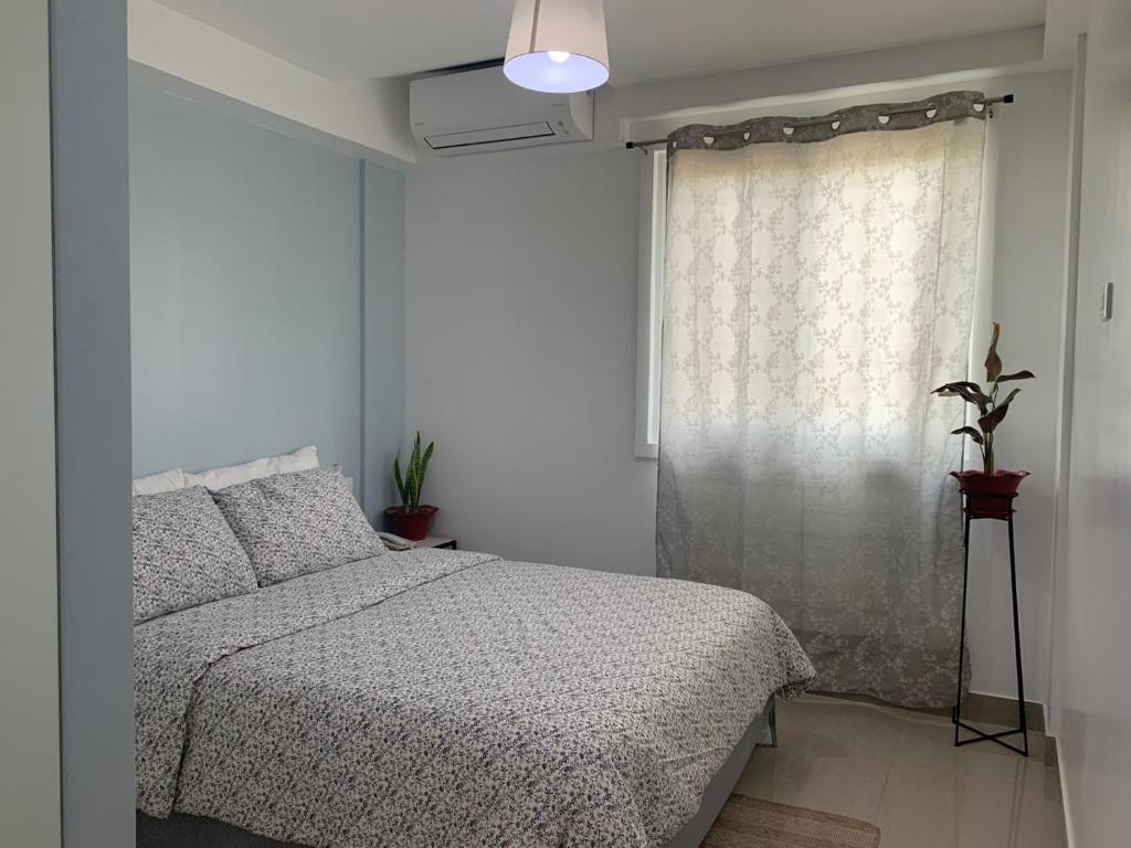 Postel nebo postele na pokoji v ubytování Cebu Mini Hotel