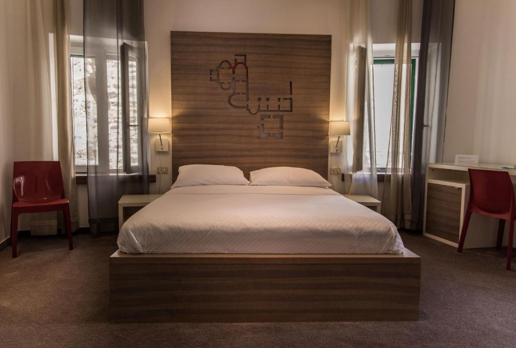 Posteľ alebo postele v izbe v ubytovaní Slavija Culture Heritage Hotel