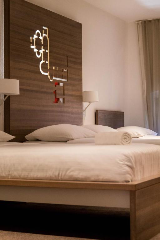 Posteľ alebo postele v izbe v ubytovaní Slavija Culture Heritage Hotel