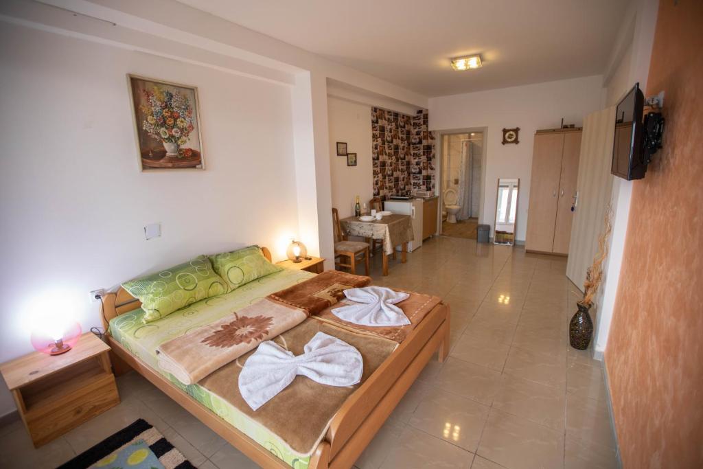 Postel nebo postele na pokoji v ubytování Apartmani Lazić