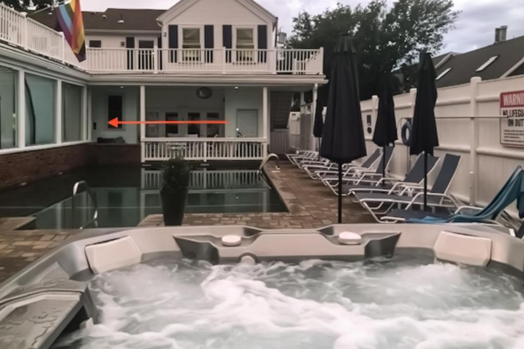 a hot tub in the backyard of a house at Captivating Cottage in Provincetown