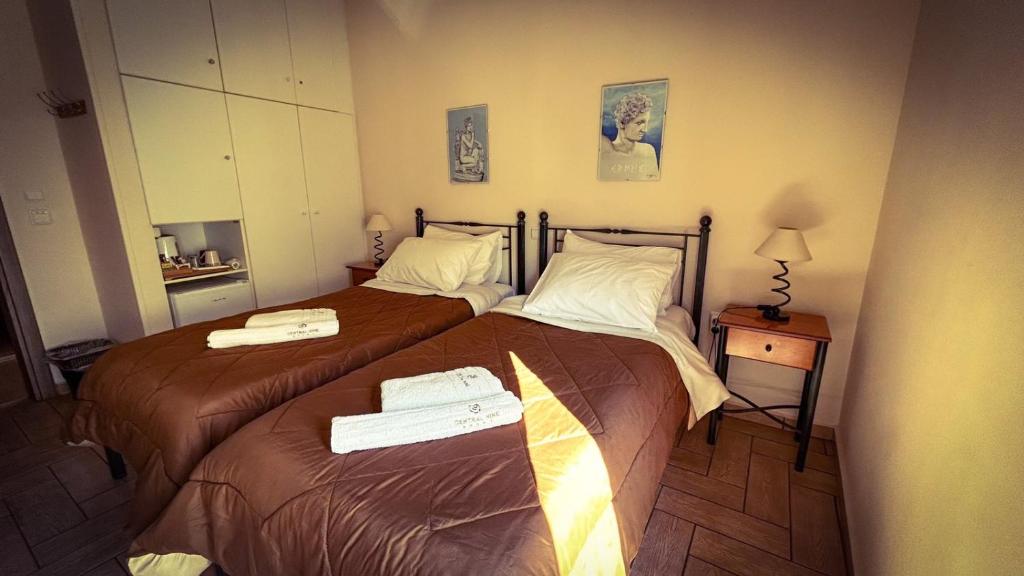 Postel nebo postele na pokoji v ubytování Central 9 Rooms