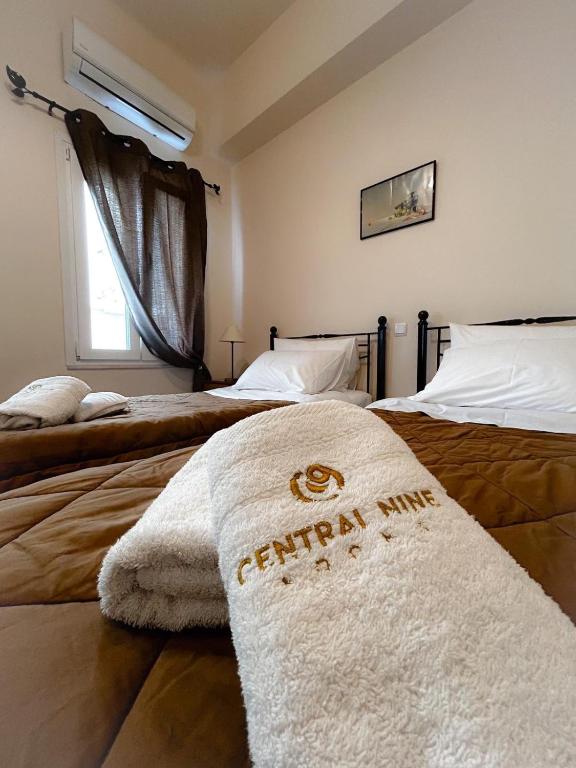 Postel nebo postele na pokoji v ubytování Central 9 Rooms
