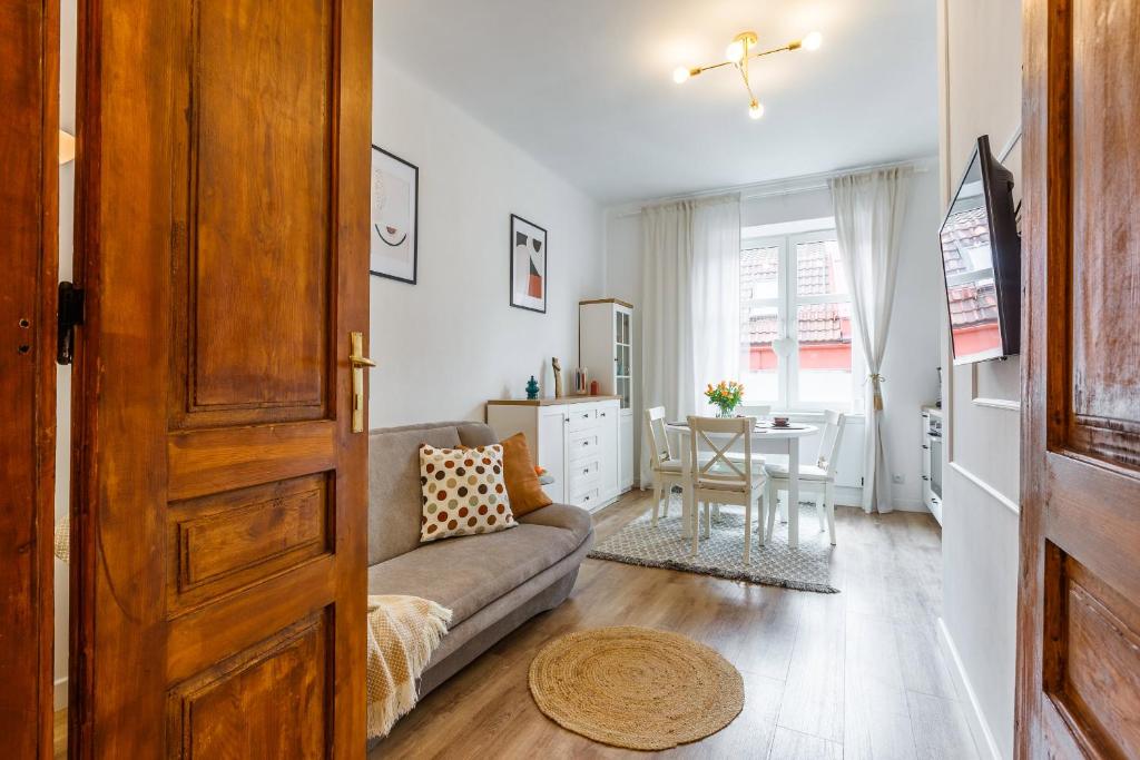 a living room with a couch and a table at Heart of Center in Rzeszów