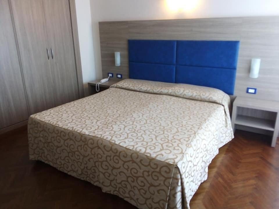 Postel nebo postele na pokoji v ubytování Grand Hotel Golf