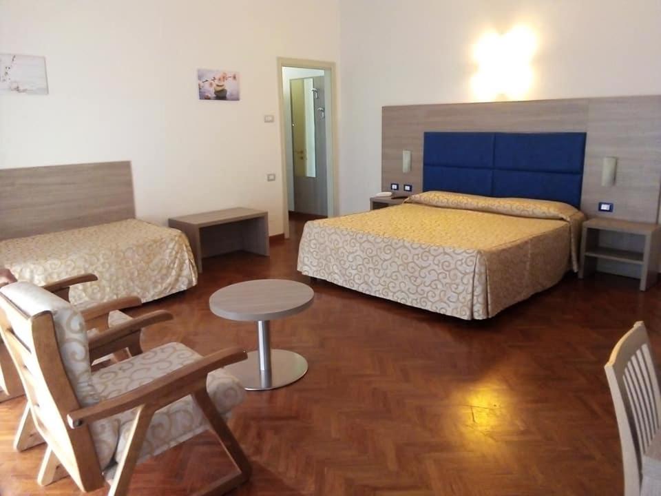 Postel nebo postele na pokoji v ubytování Grand Hotel Golf