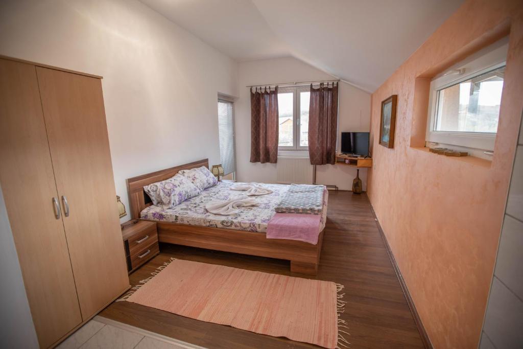 Postel nebo postele na pokoji v ubytování Apartmani Lazić