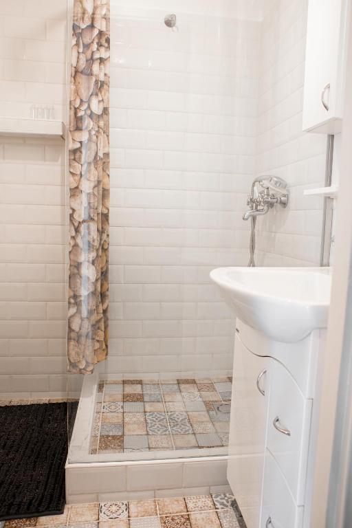 Koupelna v ubytování Városi Apartman