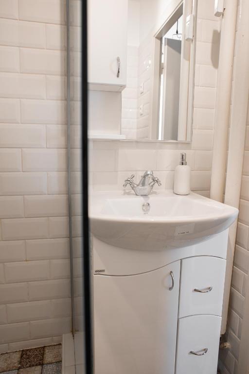 Koupelna v ubytování Városi Apartman