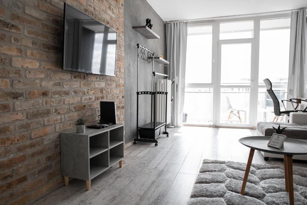 TV a/nebo společenská místnost v ubytování Városi Apartman