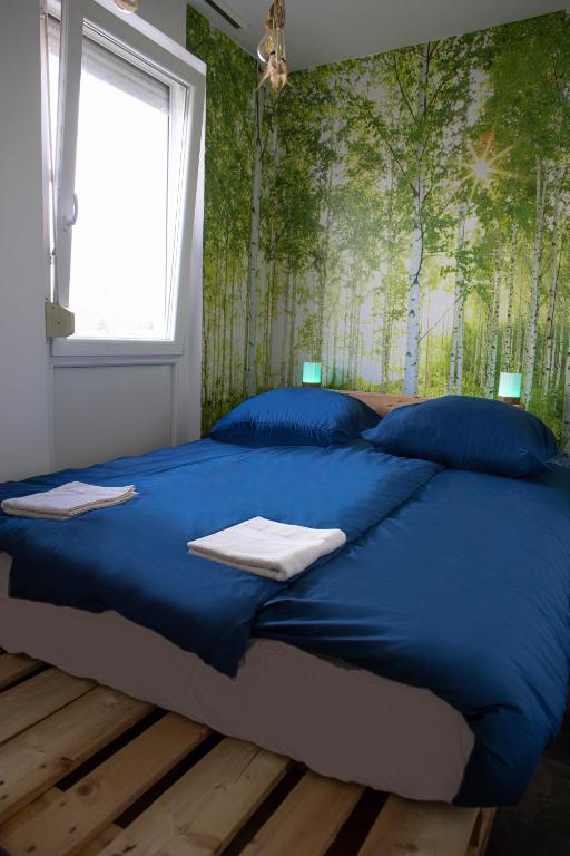 Postel nebo postele na pokoji v ubytování Városi Apartman
