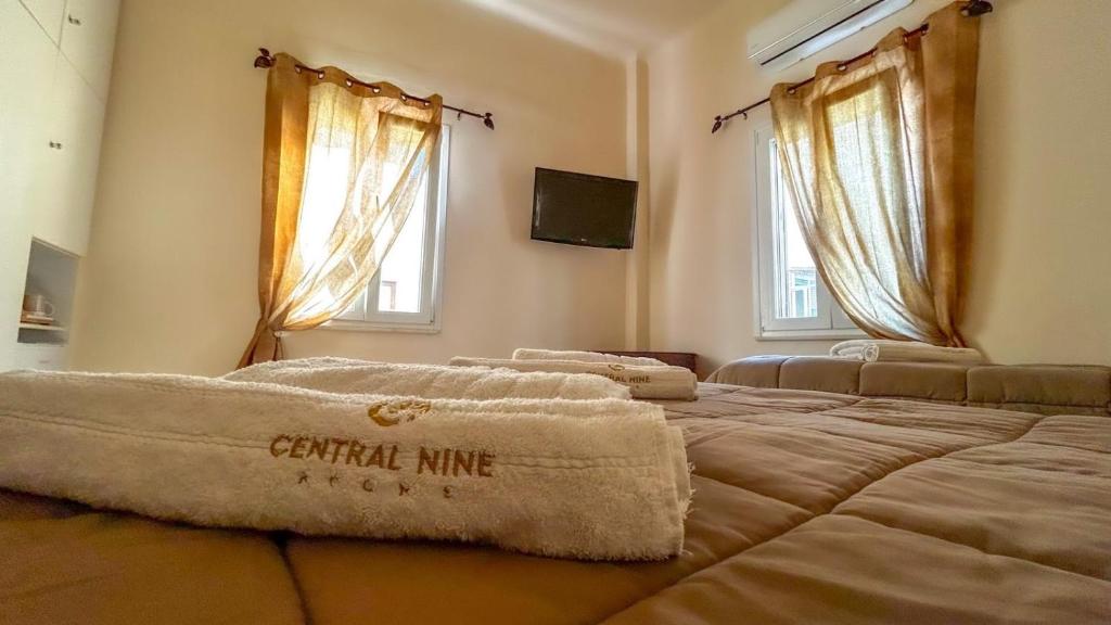 Postel nebo postele na pokoji v ubytování Central 9 Rooms