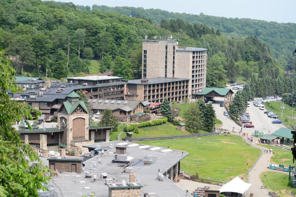 an aerial view of a town in the mountains at Slopeside Hotel, A Vail Resorts Property in Champion