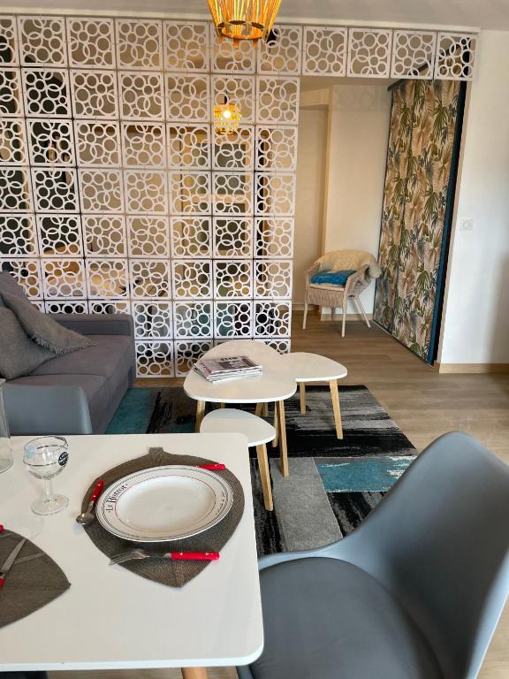 a living room with a couch and a table at Gîte des Restanques in Grasse