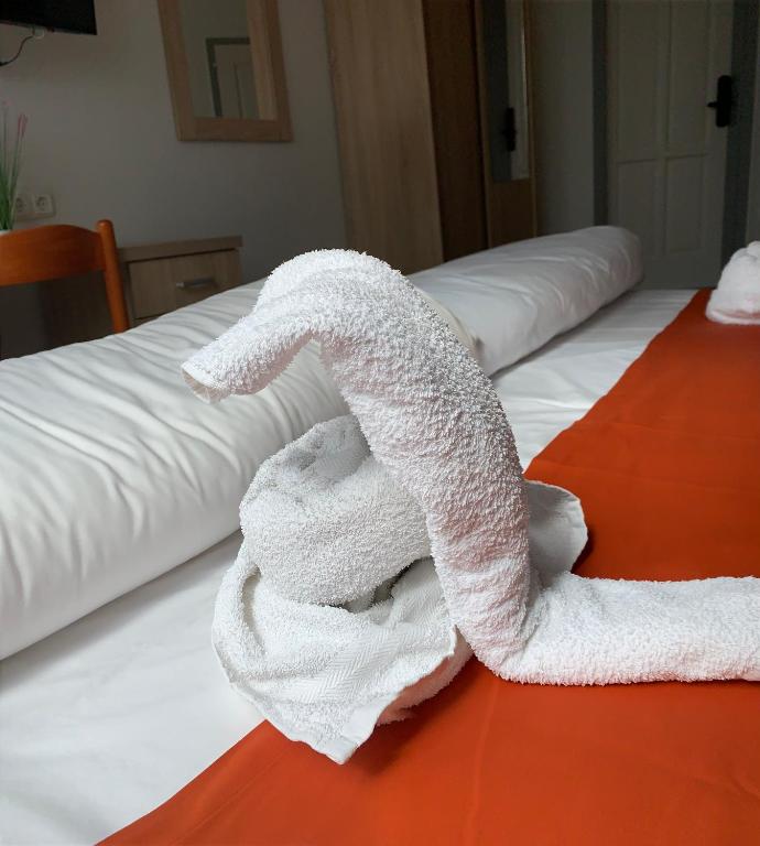 Postel nebo postele na pokoji v ubytování Várfal Wellness Panzió