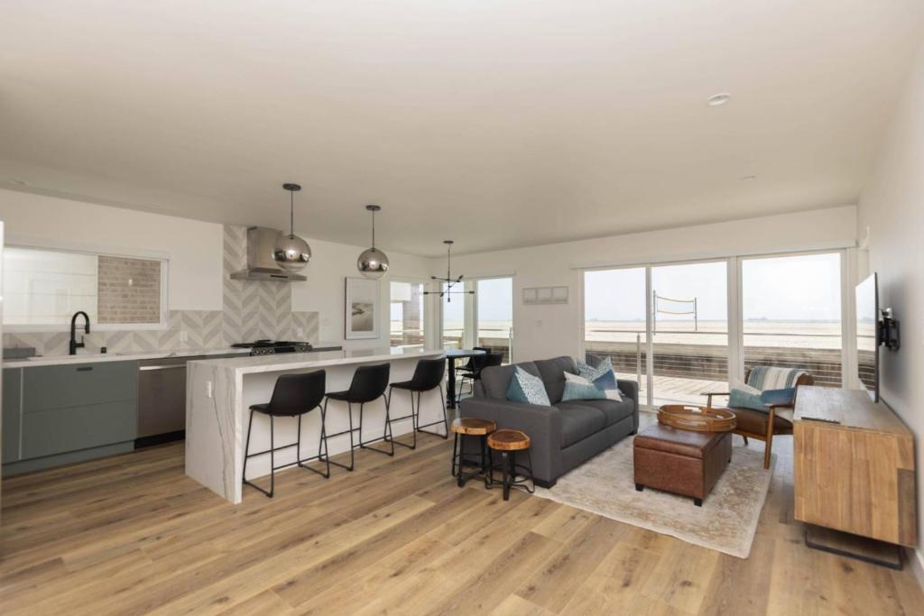 a kitchen and living room with a couch and a table at 5609 East Seaside Walk in Long Beach