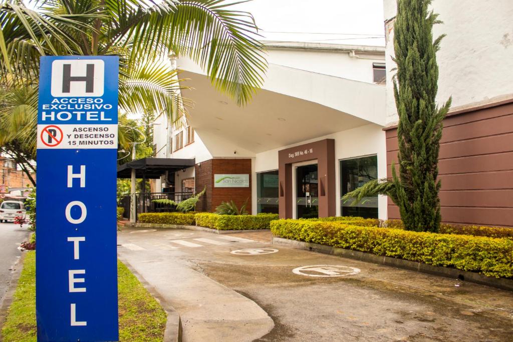 a hotel sign in front of a building at Hotel Valle de San Nicolas in Rionegro