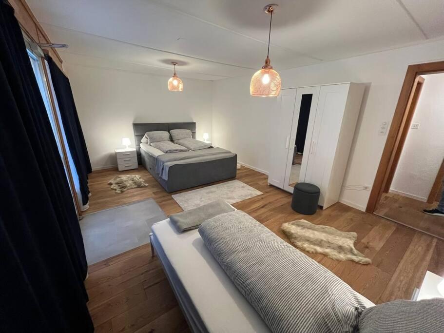 Postel nebo postele na pokoji v ubytování Alpina Appartment Kandersteg