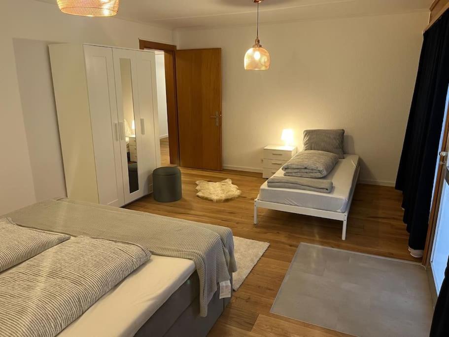 Postel nebo postele na pokoji v ubytování Alpina Appartment Kandersteg