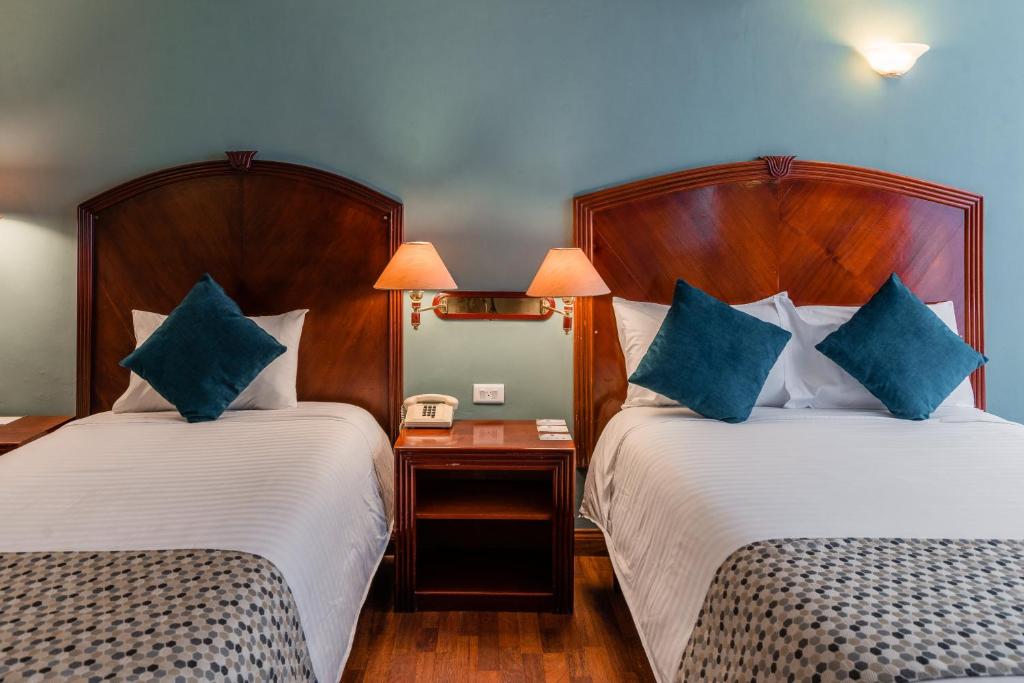 Postel nebo postele na pokoji v ubytování Hotel Libertador